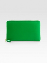 A sleek, stylish way to keep your essentials organized, crafted from sumptuously-smooth leather.Zip-around closureCenter zip compartmentTwo inside open pocketsFourteen credit card slotsGreen wallet: green interiorBlue wallet: blue interiorLeather lining8½W X 5H X 1DImported A sleek, stylish way to keep your essentials organized, crafted from sumptuously-smooth leather.Zip-around closureCenter zip compartmentTwo inside open pocketsFourteen credit card slotsGreen wallet: green interiorBlue wallet: blue interiorLeather lining8½W X 5H X 1DImported