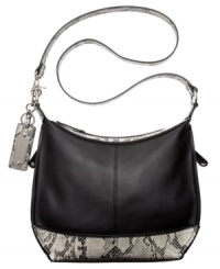 Class with sass. A classic silhouette gets an edgy upgrade with sleek python print detailing that adds just the right amount of attitude. Luxe leather is accented with gleaming silver-tone hardware, signature embossed key chain and detail stitching, while plenty of pockets inside and out offer effortless organization. Class with sass. A classic silhouette gets an edgy upgrade with sleek python print detailing that adds just the right amount of attitude. Luxe leather is accented with gleaming silver-tone hardware, signature embossed key chain and detail stitching, while plenty of pockets inside and out offer effortless organization.