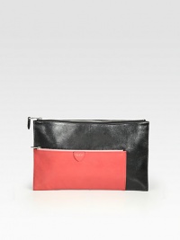 A modern style in a colorblock design.Top zip closureTwo outside zip pocketsOne inside open pocketCotton lining13¾W X 8½H X ½DMade in Italy A modern style in a colorblock design.Top zip closureTwo outside zip pocketsOne inside open pocketCotton lining13¾W X 8½H X ½DMade in Italy