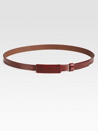 This thin leather style is finished with a small covered buckle tab.About 1 wideMade in Italy