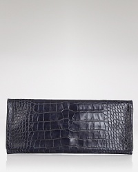 This Elie Tahari clutch brings a textured touch to your evening portfolio with rich, croc-embossed leather, styled to show a hint of skin after dark. This Elie Tahari clutch brings a textured touch to your evening portfolio with rich, croc-embossed leather, styled to show a hint of skin after dark.