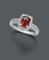 Cause a stir with this red hot number. A vivacious ring that features oval-cut garnet (1-1/10 ct. t.w.) with round-cut diamond (1/6 ct. t.w.) around the edges and in double rows at the band. Ring crafted in 14k white gold.