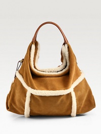 This luxuriously tactile design features a blend of soft shearling and suede with supple leather trim and a roomy interior.Double leather top handles, 7½ dropMagnetic top closureOne inside zip pocketTwo inside open pocketsCotton lining16½W X 13H X 4½DImported This luxuriously tactile design features a blend of soft shearling and suede with supple leather trim and a roomy interior.Double leather top handles, 7½ dropMagnetic top closureOne inside zip pocketTwo inside open pocketsCotton lining16½W X 13H X 4½DImported