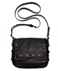 Add a little edge to your everyday accessorizing with this diva-licious design from Jessica Simpson. Decked out with rocker-chic stud accents that are softened with a flirty front bow, its interior offers plenty of compartments to stash all your essentials. Add a little edge to your everyday accessorizing with this diva-licious design from Jessica Simpson. Decked out with rocker-chic stud accents that are softened with a flirty front bow, its interior offers plenty of compartments to stash all your essentials.