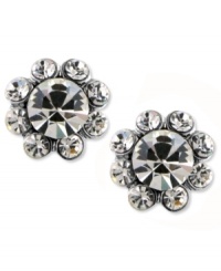 Blooms that sparkle. These 2028 earrings feature glistening glass crystal petals with a large glass crystal center. Crafted in silver tone mixed metal. Approximate diameter: 1/2 inch. Blooms that sparkle. These 2028 earrings feature glistening glass crystal petals with a large glass crystal center. Crafted in silver tone mixed metal. Approximate diameter: 1/2 inch.