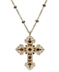 Demonstrate your faith with this elegant long necklace from Style&co. Displays an intricate cross pendant embellished with brown accents. Crafted in gold tone mixed metal. Approximate length: 36 inches. Approximate drop: 3-1/2 inches. Demonstrate your faith with this elegant long necklace from Style&co. Displays an intricate cross pendant embellished with brown accents. Crafted in gold tone mixed metal. Approximate length: 36 inches. Approximate drop: 3-1/2 inches.