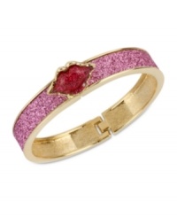 Pucker up. This bangle bracelet from Betsey Johnson is crafted from antique gold-tone mixed metal with fuchsia glass crystal accents, sealing everything with a kiss. Approximate diameter: 2-1/4 inches. Pucker up. This bangle bracelet from Betsey Johnson is crafted from antique gold-tone mixed metal with fuchsia glass crystal accents, sealing everything with a kiss. Approximate diameter: 2-1/4 inches.