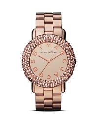 Layers of crystals illuminate a bold mirrored dial on this MARC BY MARC JACOBS plated metal watch, while an all-around logo adds a hit of brand's signature glamor. Layers of crystals illuminate a bold mirrored dial on this MARC BY MARC JACOBS plated metal watch, while an all-around logo adds a hit of brand's signature glamor.