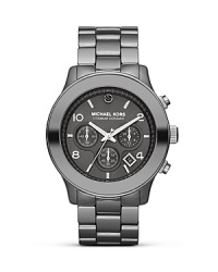 This brushed stainless steel watch by Michael Kors is a solid piece of fashion hardware, completed with a striking titanium ceramic case and black diamond accents. This brushed stainless steel watch by Michael Kors is a solid piece of fashion hardware, completed with a striking titanium ceramic case and black diamond accents.