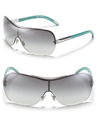 Shield sunglasses with colored temples for a playful style from Ralph by Ralph Lauren. Shield sunglasses with colored temples for a playful style from Ralph by Ralph Lauren.
