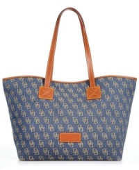 Toss in a laptop, evening wrap or almost anything you can't leave home without. This spacious silhouette from Dooney & Bourke carries your essentials with ease. Signature jacquard fabric and leather trim add graphic contrast, while plenty of pockets organize the interior. Toss in a laptop, evening wrap or almost anything you can't leave home without. This spacious silhouette from Dooney & Bourke carries your essentials with ease. Signature jacquard fabric and leather trim add graphic contrast, while plenty of pockets organize the interior.