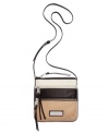 From downtown hipsters to uptown moms, this leather crossbody from Calvin Klein is the perfect companion. Mod colorblocking is paired with classic hardware for a look that's altogether irresistible.