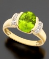 August's birthstone glows bright on this beautiful ring featuring oval-cut peridot (2-3/5 ct. t.w.) and round cut diamond accents set in 14k gold.