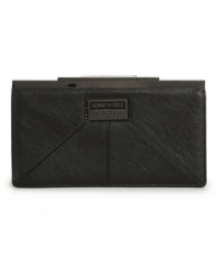 Sophisticated and stylish. This refined wallet by Kenneth Cole Reaction features an all-over slight sheen, signature plaque at front and sleek kiss lock closure. Sophisticated and stylish. This refined wallet by Kenneth Cole Reaction features an all-over slight sheen, signature plaque at front and sleek kiss lock closure.