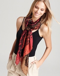 Go wild for Salvatore Ferragamo's sheer oblong scarf featuring a fun, ombré leopard print. Go wild for Salvatore Ferragamo's sheer oblong scarf featuring a fun, ombré leopard print.