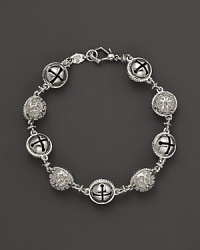 Inspired by Zen philosophy, this intricately detailed sterling silver bracelet from Paul Morelli softly jingles with meditation bells. Inspired by Zen philosophy, this intricately detailed sterling silver bracelet from Paul Morelli softly jingles with meditation bells.