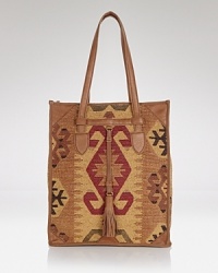 Isabella Fiore crafts this all-purpose tote in tapestry fabric and leather, perfect for introducing bohemian luxe style to your day-to-day look. Isabella Fiore crafts this all-purpose tote in tapestry fabric and leather, perfect for introducing bohemian luxe style to your day-to-day look.