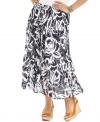 Take your look to great lengths this season with J Jones New York's plus size maxi skirt, featuring a bold floral-print.