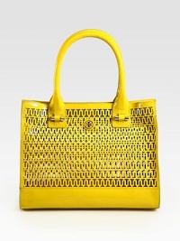 A roomy, shiny patent leather carryall is given an extra dose of style with an allover cutout geometric print. Double top handles, 7¼ dropMagnetic snap closureProtective metal feet13¾W X 10½H X 3¼DImported A roomy, shiny patent leather carryall is given an extra dose of style with an allover cutout geometric print. Double top handles, 7¼ dropMagnetic snap closureProtective metal feet13¾W X 10½H X 3¼DImported