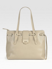 From the 24:7 Collection. Uniquely versatile grainy leather bag, topped with a slim belt looping through edgy grommets.Shoulder straps, 9 drop Top zip with flip-lock strap closure Protective metal feet One inside zip pocket Two inside open pockets Suede lining 15W X 11H X 8D Made in Italy From the 24:7 Collection. Uniquely versatile grainy leather bag, topped with a slim belt looping through edgy grommets.Shoulder straps, 9 drop Top zip with flip-lock strap closure Protective metal feet One inside zip pocket Two inside open pockets Suede lining 15W X 11H X 8D Made in Italy