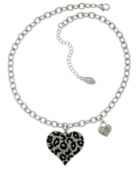 GUESS shows it has its heart in the right place with this necklace. Crafted from silver-tone mixed metal with glass crystal stones and jet accents for a stylish effect. Approximate length: 16 inches + 2-inch extender. Approximate drop: 1-1/2 inches. GUESS shows it has its heart in the right place with this necklace. Crafted from silver-tone mixed metal with glass crystal stones and jet accents for a stylish effect. Approximate length: 16 inches + 2-inch extender. Approximate drop: 1-1/2 inches.