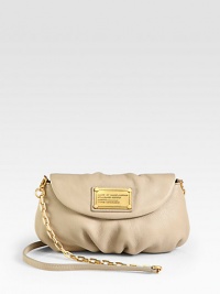A convertible silhouette of soft and slouchy leather with a chic chain and leather strap.Removable shoulder strap, 23 dropMagnetic flap closureSix credit card slotsOne inside open pocketFully lined9W X 5½H X 3/4DImported A convertible silhouette of soft and slouchy leather with a chic chain and leather strap.Removable shoulder strap, 23 dropMagnetic flap closureSix credit card slotsOne inside open pocketFully lined9W X 5½H X 3/4DImported