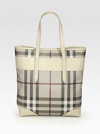 Iconic trench check printed coated denim accented in luxuriously smooth leather.Double leather shoulder straps, 7½ dropMagnetic snap closureOne inside zip pocketTwo inside open pocketsCotton lining13W X 15H X 3½DMade in Italy Iconic trench check printed coated denim accented in luxuriously smooth leather.Double leather shoulder straps, 7½ dropMagnetic snap closureOne inside zip pocketTwo inside open pocketsCotton lining13W X 15H X 3½DMade in Italy