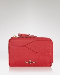 Cole Haan makes a case for the smallest essentials with this leather card holder, which features 3 slip pockets and a secure zip top closure. Cole Haan makes a case for the smallest essentials with this leather card holder, which features 3 slip pockets and a secure zip top closure.