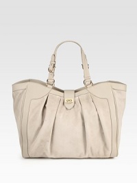 A classic top-handle design combining smooth leather and ultra-touchable suede, finished with feminine center pleats. Adjustable double leather top handles, 7½-8½ dropTop zip closureProtective metal feetOne inside zip pocketTwo inside open pocketsFully lined14W X 11H X 4½DMade in Italy A classic top-handle design combining smooth leather and ultra-touchable suede, finished with feminine center pleats. Adjustable double leather top handles, 7½-8½ dropTop zip closureProtective metal feetOne inside zip pocketTwo inside open pocketsFully lined14W X 11H X 4½DMade in Italy