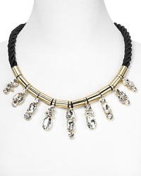 Crystal stones dress up a twisted cord on this collar necklace from nOir. Equal parts crafty and cool, it instantly adds some summer-perfect sparkle. Crystal stones dress up a twisted cord on this collar necklace from nOir. Equal parts crafty and cool, it instantly adds some summer-perfect sparkle.