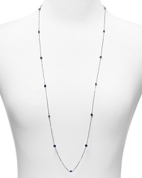 An elegant cascade of scattered sapphire stones illuminates this Crislu necklace, crafted of sterling silver with a pure platinum finish. An elegant cascade of scattered sapphire stones illuminates this Crislu necklace, crafted of sterling silver with a pure platinum finish.