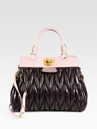 This quilted leather style is accented with contrast leather trim for a statement look.Double top handles, 5½ dropDetachable adjustable shoulder strap, 19-20¾ dropTurnlock closureThree inner compartmentsThree inside zip pocketsThree inside open pocketsSatin lining13¼W X 10H X 7DMade in Italy This quilted leather style is accented with contrast leather trim for a statement look.Double top handles, 5½ dropDetachable adjustable shoulder strap, 19-20¾ dropTurnlock closureThree inner compartmentsThree inside zip pocketsThree inside open pocketsSatin lining13¼W X 10H X 7DMade in Italy