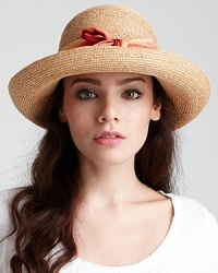 A charming raffia sun hat with rolled brim and ombré ribbon trim. A charming raffia sun hat with rolled brim and ombré ribbon trim.