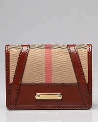 Burberry's signature motif keeps your smallest essentials in check. Burberry's signature motif keeps your smallest essentials in check.