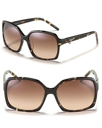 Hit the streets in chic oversized sunglasses with signature metal logo detail along arms from Fendi. Hit the streets in chic oversized sunglasses with signature metal logo detail along arms from Fendi.