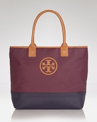 Take this season's color block trend with you anywhere and fill it with everything. This dipped canvas tote from Tory Burch flaunts practical style, sturdy trims, and a must-have mixed media finish. Take this season's color block trend with you anywhere and fill it with everything. This dipped canvas tote from Tory Burch flaunts practical style, sturdy trims, and a must-have mixed media finish.