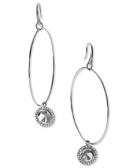 Let your look shine! These hoop earrings from Michael Kors flaunt a circular pendant with a cubic zirconia stone. Crafted in silver tone mixed metal. Approximate drop: 2-1/2 inches. Let your look shine! These hoop earrings from Michael Kors flaunt a circular pendant with a cubic zirconia stone. Crafted in silver tone mixed metal. Approximate drop: 2-1/2 inches.