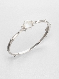 From the Superstud Collection. A graceful bangle of bright sterling silver is dotted with pointy studs and highlighted by a faceted cushion of mother-of-pearl layered with clear quartz for a luminous effect.Mother-of-pearl and clear quartzRhodium-plated sterling silverDiameter, about 2.25Box-and-tongue claspImported From the Superstud Collection. A graceful bangle of bright sterling silver is dotted with pointy studs and highlighted by a faceted cushion of mother-of-pearl layered with clear quartz for a luminous effect.Mother-of-pearl and clear quartzRhodium-plated sterling silverDiameter, about 2.25Box-and-tongue claspImported