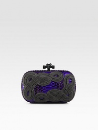 The beautiful Italian quality and craftsmanship of this brand is evident in this knotted rope accented python design.Top clasp closureSuede lining7½W X 4½H X 1½DMade in Italy The beautiful Italian quality and craftsmanship of this brand is evident in this knotted rope accented python design.Top clasp closureSuede lining7½W X 4½H X 1½DMade in Italy