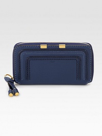 Luxurious leather with stitched details in a secure zip-around design.Zip-around closureStitched detailOne inside zip pocketTwo bill compartmentsTwelve credit card slotsCotton lining7½W X 4½H X ¾DMade in Italy Luxurious leather with stitched details in a secure zip-around design.Zip-around closureStitched detailOne inside zip pocketTwo bill compartmentsTwelve credit card slotsCotton lining7½W X 4½H X ¾DMade in Italy