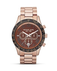 High impact accessories are on our radar. Perfect the look with this over sized rose gold watch from MICHAEL Michael Kors, featuring chronograph movement and a superfine sun-ray dial. High impact accessories are on our radar. Perfect the look with this over sized rose gold watch from MICHAEL Michael Kors, featuring chronograph movement and a superfine sun-ray dial.