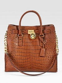A roomy carryall in luxurious crocodile embossed leather with radiant hardware.Double top handles, 4½ dropShoulder strap, 11¾ dropMagnetic snap closureProtective metal feetOne inside zip pocketFour inside open pocketsCotton lining14¼W X 13H X 6DImported A roomy carryall in luxurious crocodile embossed leather with radiant hardware.Double top handles, 4½ dropShoulder strap, 11¾ dropMagnetic snap closureProtective metal feetOne inside zip pocketFour inside open pocketsCotton lining14¼W X 13H X 6DImported