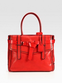 Inspired by the wrappings of a boxer's glove, this spacious tote features bold color and contrasting edge stain details.Double top handles, 8 dropOpen topProtective metal feetOne outside open pocketOne outside flap pocketThree inner compartmentsThree inside zip pocketTwo inside open pocketsCotton lining14W X 11½H X 4½DImported Inspired by the wrappings of a boxer's glove, this spacious tote features bold color and contrasting edge stain details.Double top handles, 8 dropOpen topProtective metal feetOne outside open pocketOne outside flap pocketThree inner compartmentsThree inside zip pocketTwo inside open pocketsCotton lining14W X 11½H X 4½DImported