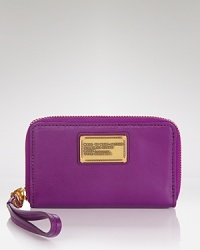MARC BY MARC JACOBS' translates its always on-trend style to technology with this iPhone wristlet. Crafted of leather and accented by the designer's signature plaque, it's a case that's totally on point. MARC BY MARC JACOBS' translates its always on-trend style to technology with this iPhone wristlet. Crafted of leather and accented by the designer's signature plaque, it's a case that's totally on point.