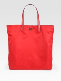 Vela fabric tote with nylon and saffiano leather trim.Double handles, 8 dropEnamel triangle logoPolished steel hardwareOne inside zip pocketPrada logo lining16W X 15H X 3DMade in Italy Vela fabric tote with nylon and saffiano leather trim.Double handles, 8 dropEnamel triangle logoPolished steel hardwareOne inside zip pocketPrada logo lining16W X 15H X 3DMade in Italy