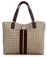 A timeless silhouette gets a preppy makeover with this take-anywhere tote from Tommy Hilfiger. Signature jacquard is outfitted with custom golden hardware and contrast striping, while the generous interior carries all your essentials from work to weekend. A timeless silhouette gets a preppy makeover with this take-anywhere tote from Tommy Hilfiger. Signature jacquard is outfitted with custom golden hardware and contrast striping, while the generous interior carries all your essentials from work to weekend.