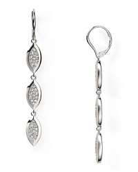A geometric cascade of crystal-adorned stations descends from silvery leverbacks on this pair of Nadri earrings, ideal for day-to-night elegance. A geometric cascade of crystal-adorned stations descends from silvery leverbacks on this pair of Nadri earrings, ideal for day-to-night elegance.