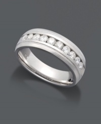 Eternal style meets with a little extra shine. This luminous men's wedding band highlights a seamless row of round-cut diamonds (1/4 ct. t.w.) channel-set in polished sterling silver. Size 10-1/2. Eternal style meets with a little extra shine. This luminous men's wedding band highlights a seamless row of round-cut diamonds (1/4 ct. t.w.) channel-set in polished sterling silver. Size 10-1/2.