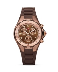 Make time for arm candy with Michele's sweet and sporty Jelly Bean watch, styled with an engraved bezel, three-eye chronograph dial, and silicone strap. Make time for arm candy with Michele's sweet and sporty Jelly Bean watch, styled with an engraved bezel, three-eye chronograph dial, and silicone strap.