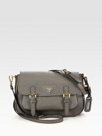 Crossbody design in textured saffiano lux leather.Detachable adjustable shoulder strap, 19-23 dropBuckled flap closureOne outside open pocketOne open pocket under flapOne inside zip pocketOne inside open pocketSignature jacquard lining11W X 8H X 3½DMade in Italy Crossbody design in textured saffiano lux leather.Detachable adjustable shoulder strap, 19-23 dropBuckled flap closureOne outside open pocketOne open pocket under flapOne inside zip pocketOne inside open pocketSignature jacquard lining11W X 8H X 3½DMade in Italy